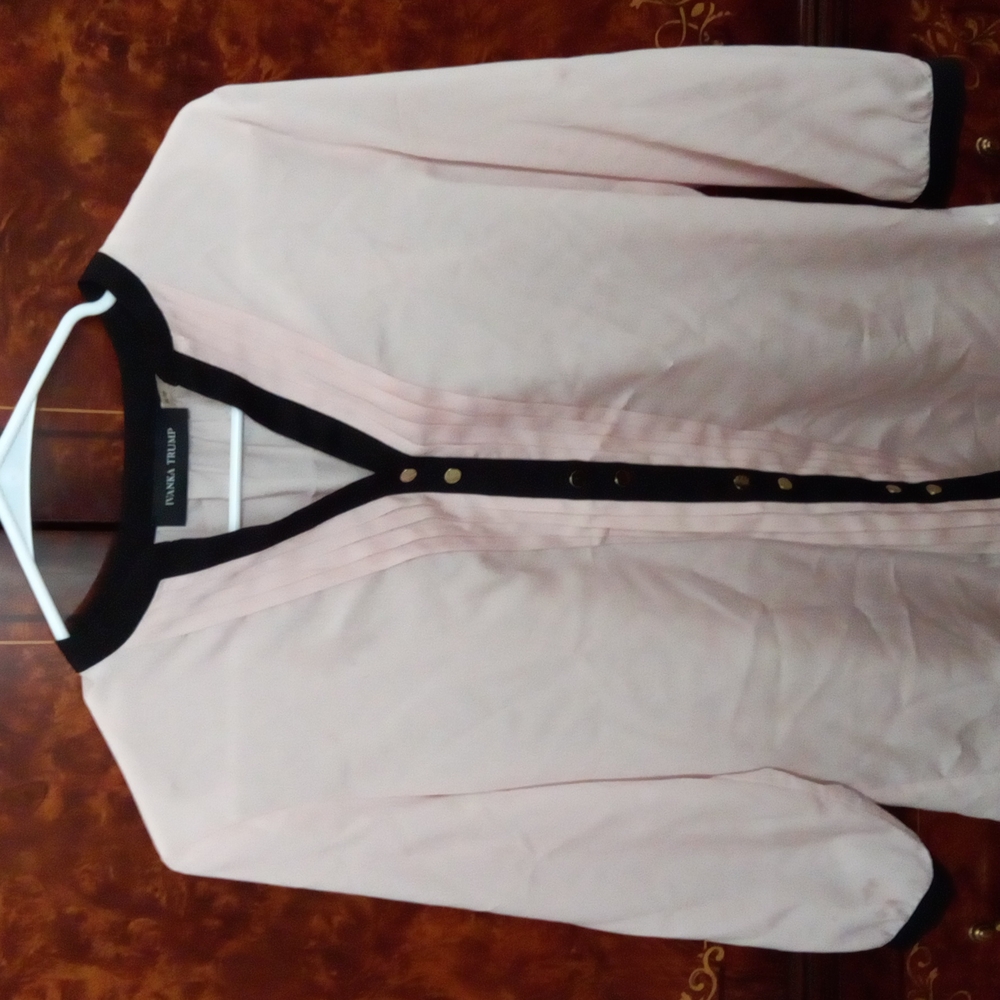 Ivanka Trump baby pink silk blouse.